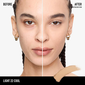 bareMinerals open compact with included sponge demonstrating travel-ready convenience