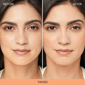 bareMinerals powder applied with brush on hand to show blendability benefit