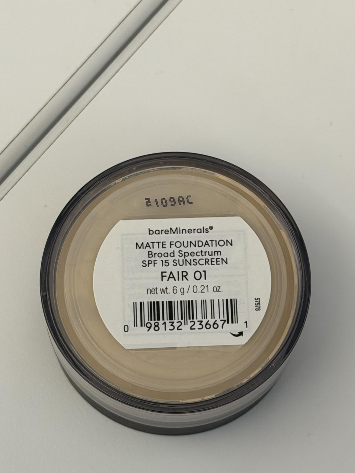 bareMinerals clean ingredients list bottle emphasizing vegan formulation