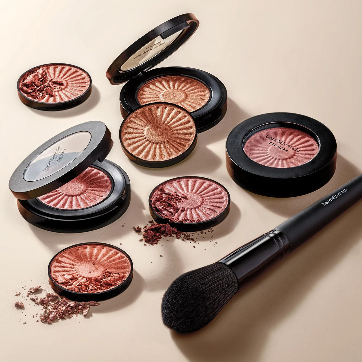 bareMinerals compact in hand for size comparison showing travel-friendly portability