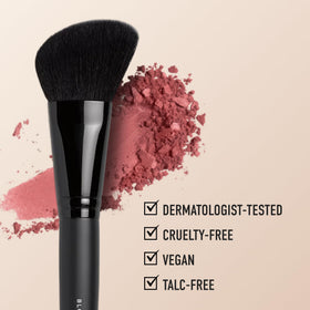 bareMinerals jar held in hand to show size and convenient travel-friendly benefit
