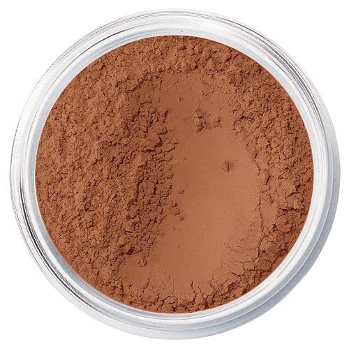 bareMinerals compact jar held in hand to show size and travel-friendly convenient packaging
