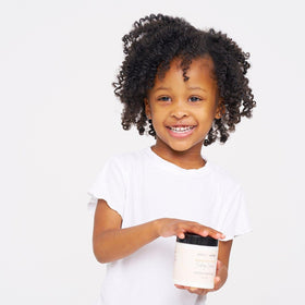 BASK & LATHER applied in curly hair showing defined, frizz-reduced results