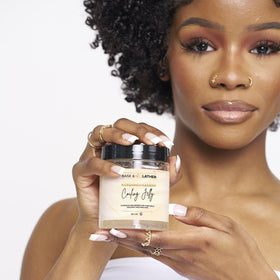 BASK & LATHER applied to wet curls demonstrating hydration and defined coil shaping