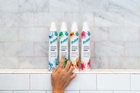 Batiste being applied to curly hair for quick in-between wash refresh