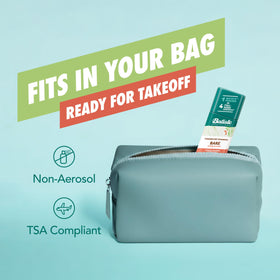 Batiste Bare inside a travel bag staged for on-the-go hair touch-ups