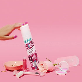 Batiste applied to hair before and after to show cleaner-looking roots