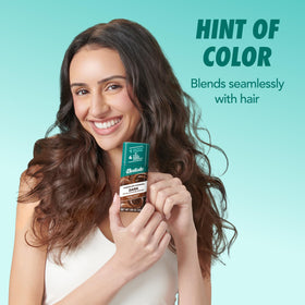 Batiste hair after brushing showcasing blended tint and added volume