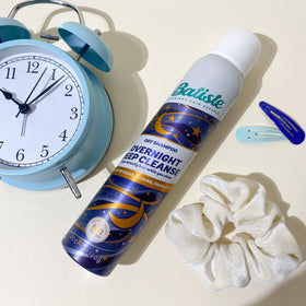Batiste can held in hand to show 3.81 oz travel-friendly scale