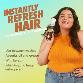 Batiste held in hand for size scale and convenient on-the-go benefit