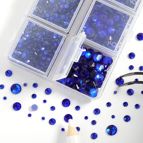 BEADSLAND rhinestones being ironed onto a blue dress demonstrating secure heat application