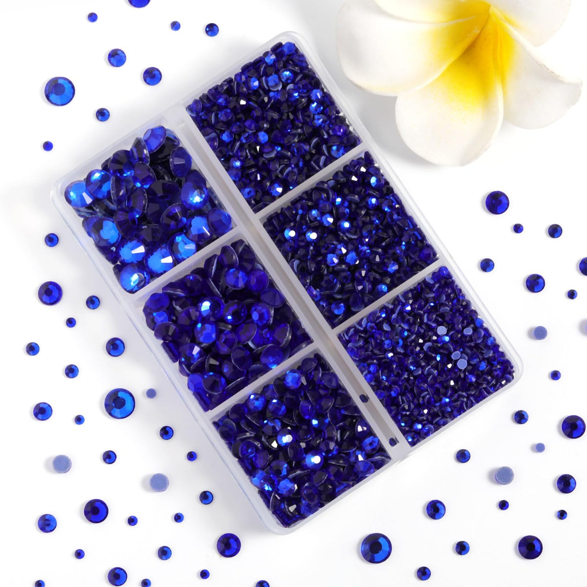 BEADSLAND close-up of sapphire rhinestone facets showing sparkle and clear adhesive back