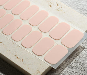 Beaolata applying a strip to a nail demonstrating easy at-home application