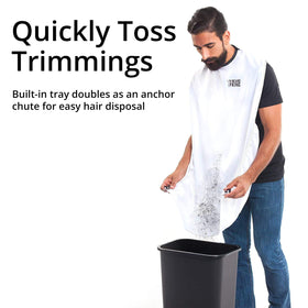 BEARD KING apron beside a razor showing size and scale for home use