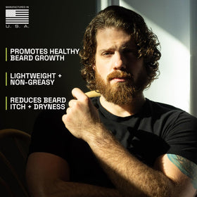 Beardbrand 2 oz bottle beside ruler showing compact travel-friendly size