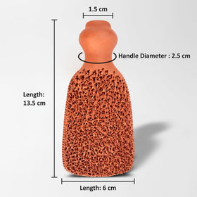 Beauticone pumice stone beside a hand showing scale so buyers can judge size and grip comfort