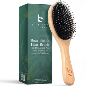 Beauty by Earth front view of boar bristle brush showing paddle shape and handle benefit smoothing