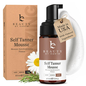 Beauty by Earth front packaging of ultra dark self tanner mousse showing product benefit