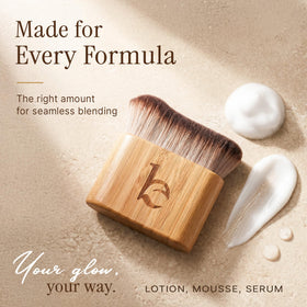 Beauty by Earth brush flatlay with tanning products demonstrating versatile compatibility