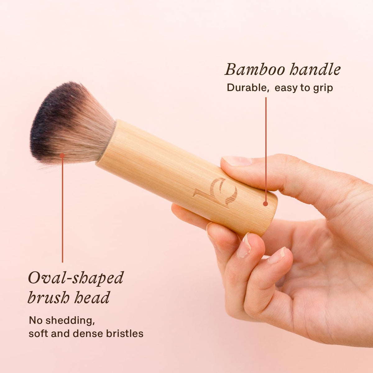 Beauty by Earth brush next to coin showing compact travel size and portability