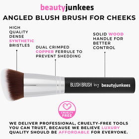 Beauty Junkees brush in hand showing size and ergonomic handle benefit