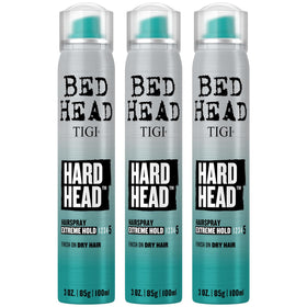 Bed Head Hard Head front packaging showing compact travel cans and apple scent benefit