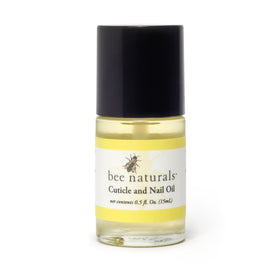 Bee Naturals close-up oil drop texture on fingertip, highlights fast absorption