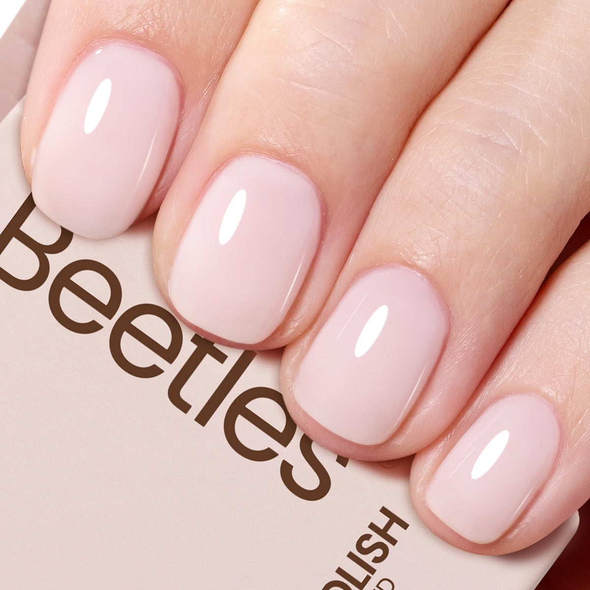 beetles bottle front view showing milky pink shade and brand benefits