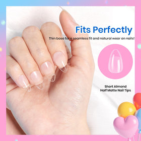 beetles hand applying a press-on tip for quick at-home manicure
