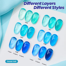 Beetles jelly gel color swatches laid out to compare translucent blue and green shades for layering ideas