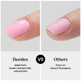 beetles lifestyle shot of woman wearing short almond nails confidently