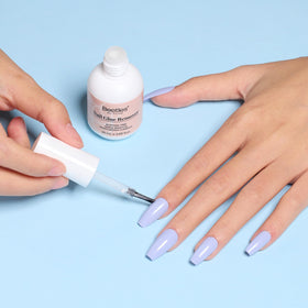 Beetles fine-tip brush applying remover to nail base for precise control