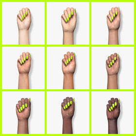 Beetles swatched on fingers showcasing bright lime finish and salon look