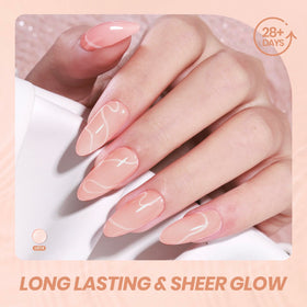 beetles nails with French tips showing sheer pink nude base for elegant style