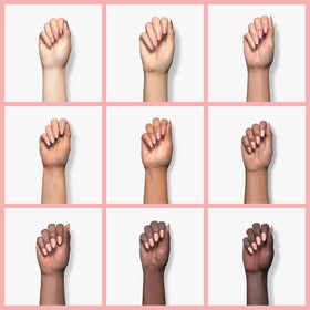 Beetles swatch on fingers demonstrating sheer nude pink for subtle concealing effect