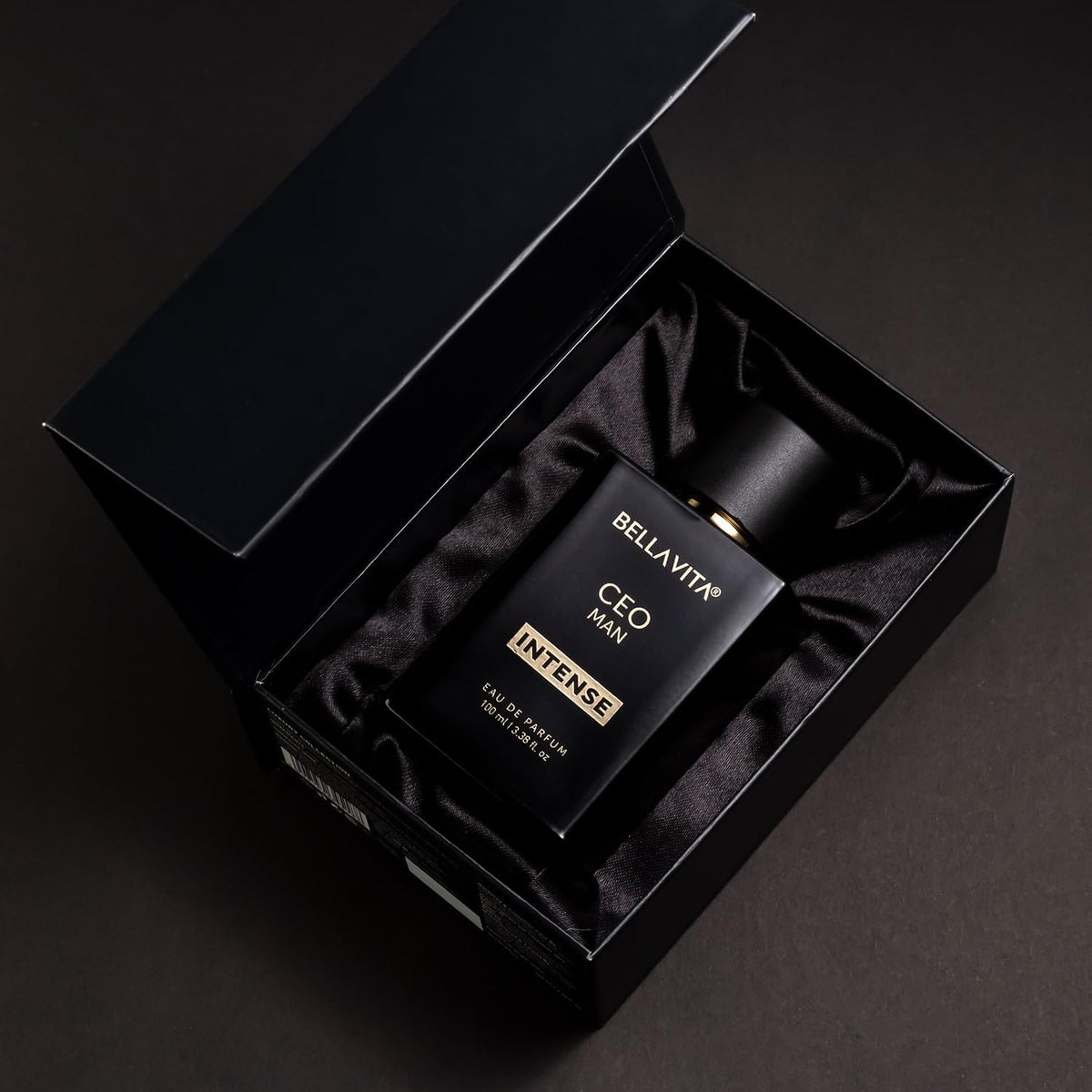 Bella Vita Luxury bottle on office desk conveying confident professional appeal