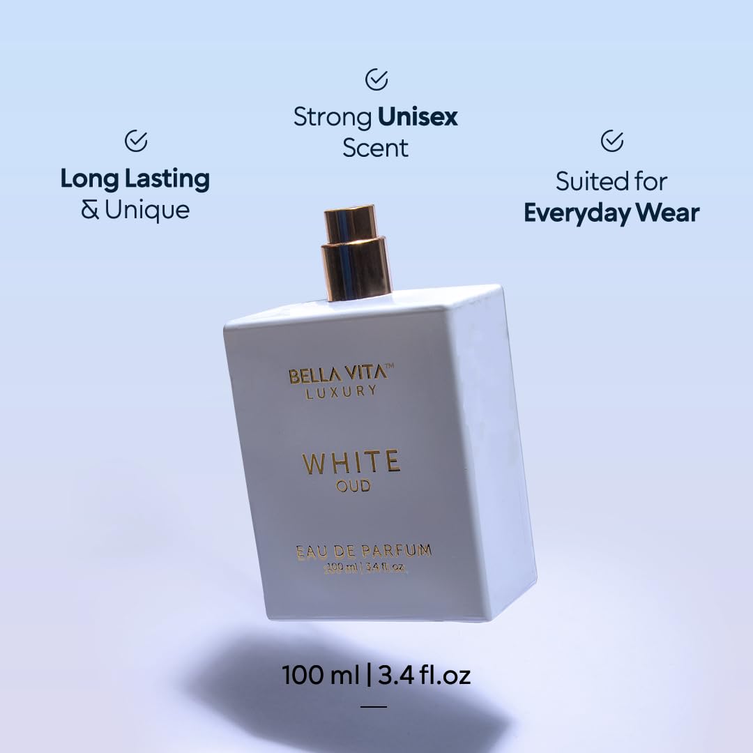 Bellavita Luxury White Oud poured beside glass illustrating color and pour consistency