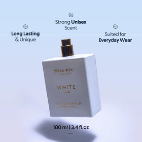 Bellavita Luxury White Oud poured beside glass illustrating color and pour consistency