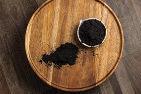 Belle Chemical being mixed into facial scrub illustrating easy incorporation and cosmetic use