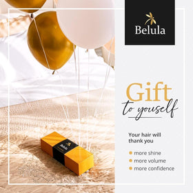 Belula brush held in hand to show size and portability benefits