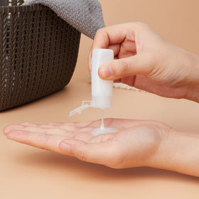 BENECREAT squeezing bottle to show soft plastic texture and controlled dispensing