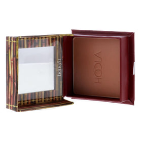 Benefit Hoola held in hand for size and scale, ideal portable bronzer