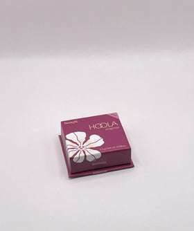 Benefit Hoola swatch on arm showing blendable matte warmth and buildable color