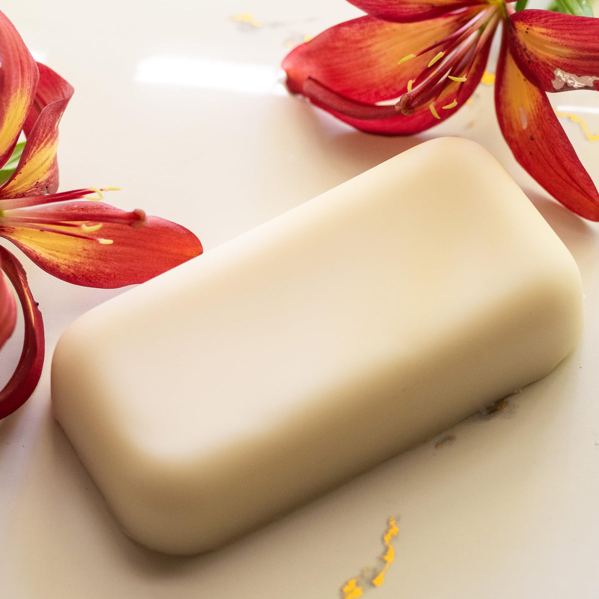 Better Shea Butter on bathroom vanity among toiletries indicating daily skincare use