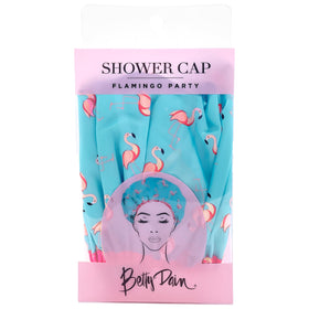 Betty Dain flamingo cap beside ruler scale showing oversized fit advantage