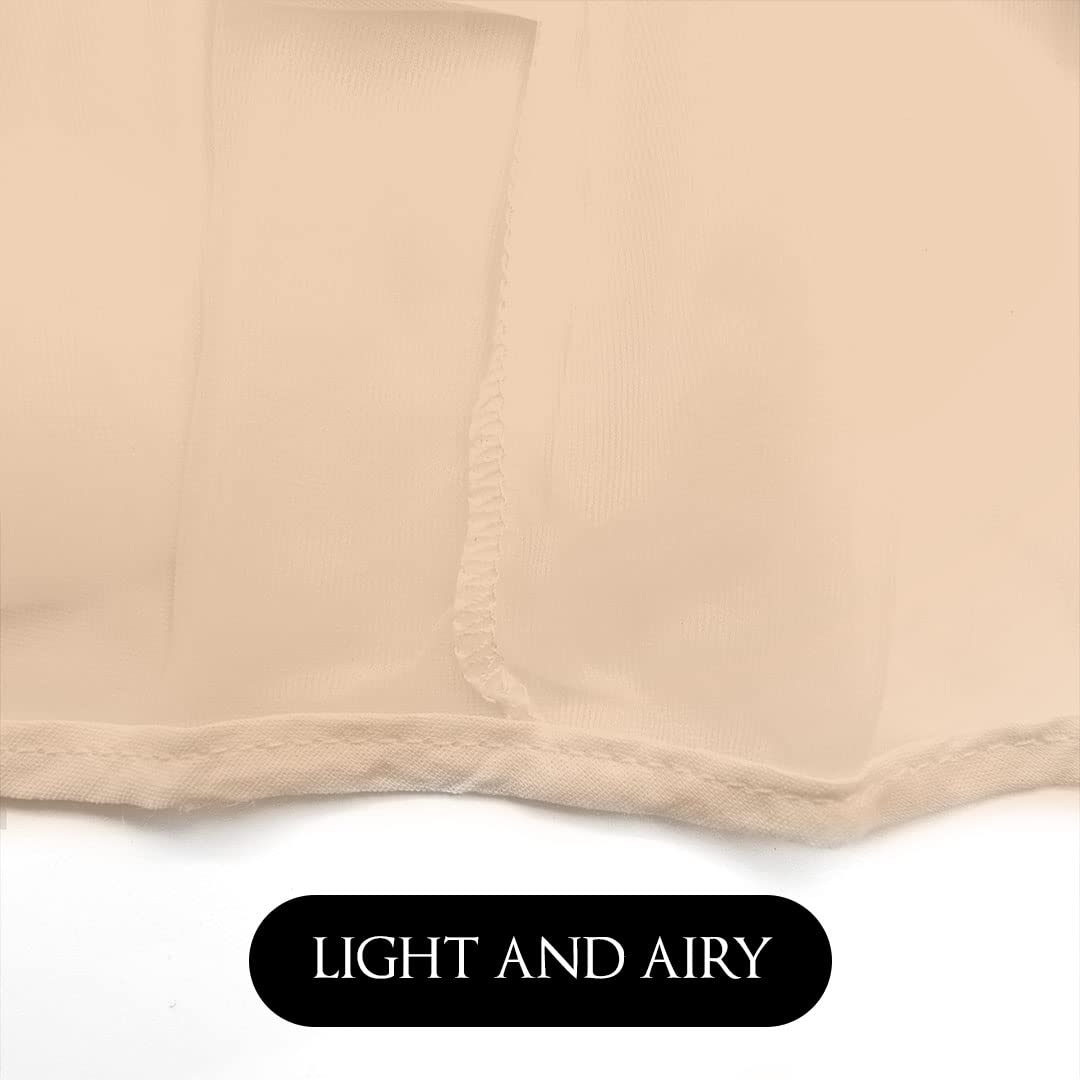 Betty Dain hood on model during dressing prevents gown contact with makeup