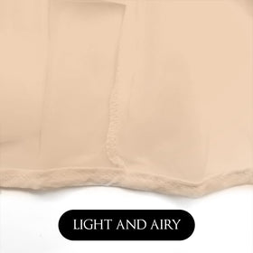 Betty Dain hood on model during dressing prevents gown contact with makeup