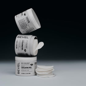Bevel pads pictured with face wash and moisturizer for routine