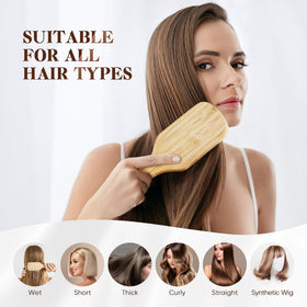 BFWood brush held in hand styling hair, controlled styling and massage benefit