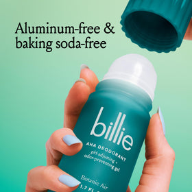 Billie 1.7oz bottle next to common items to show compact travel-friendly size